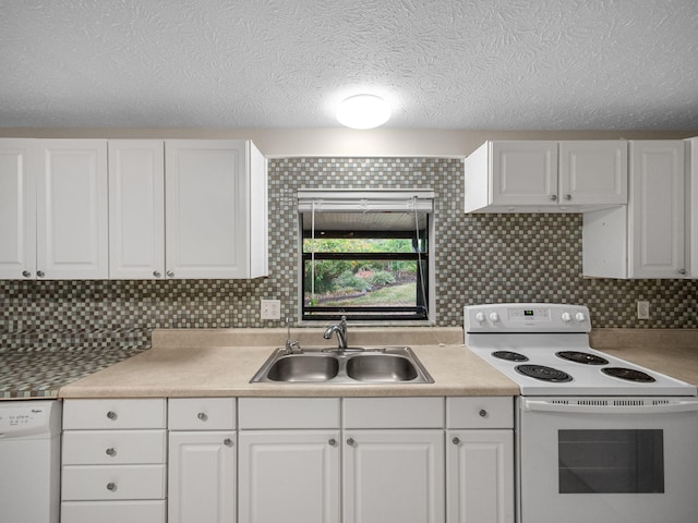 kitchen with a sink, white cabinetry, white appliances, light countertops, and decorative backsplash