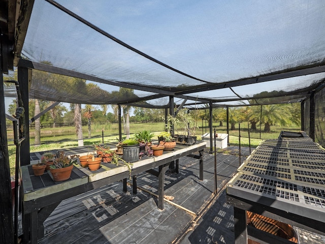 wooden terrace with a patio area