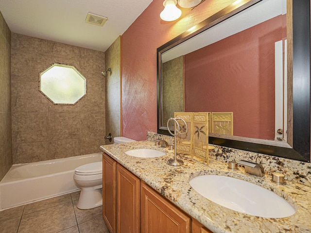 bathroom featuring washtub / shower combination, visible vents, a sink, tile patterned floors, and toilet