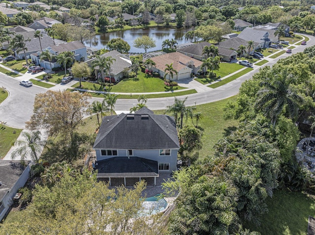 birds eye view of property featuring a residential view and a water view