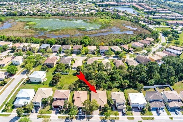 bird's eye view with a residential view and a water view