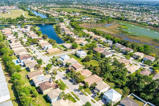 bird's eye view with a residential view and a water view