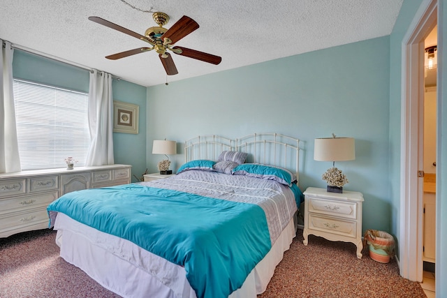 bedroom featuring carpet, a ceiling fan, and a textured ceiling