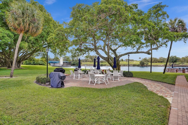 view of yard with a patio area and a water view