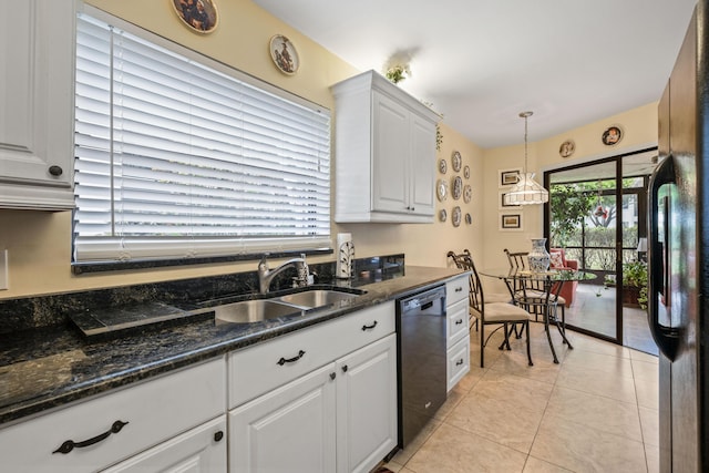 kitchen featuring pendant lighting, light tile patterned floors, white cabinets, black appliances, and a sink