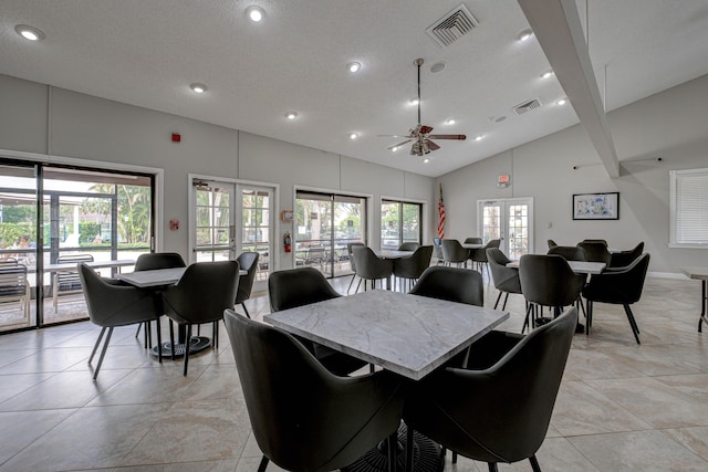 dining room featuring visible vents, a healthy amount of sunlight, and ceiling fan