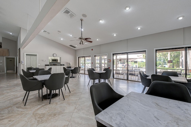 dining area with recessed lighting, visible vents, high vaulted ceiling, and a ceiling fan