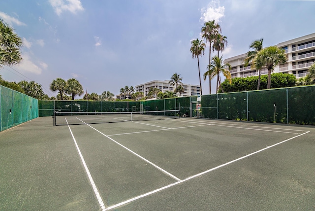 view of sport court with fence