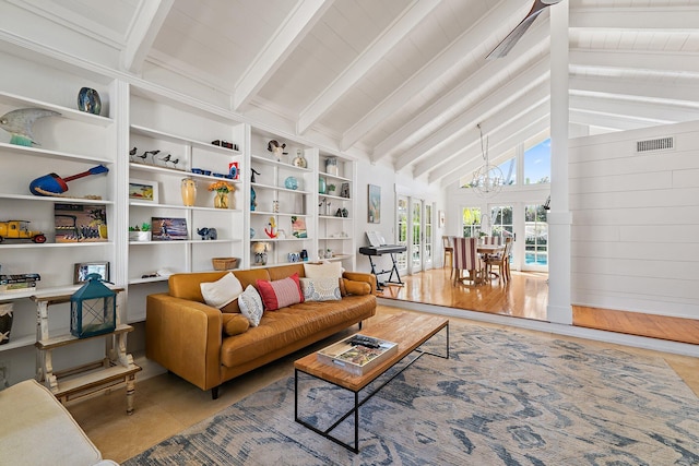 living area featuring built in features, visible vents, an inviting chandelier, and vaulted ceiling with beams