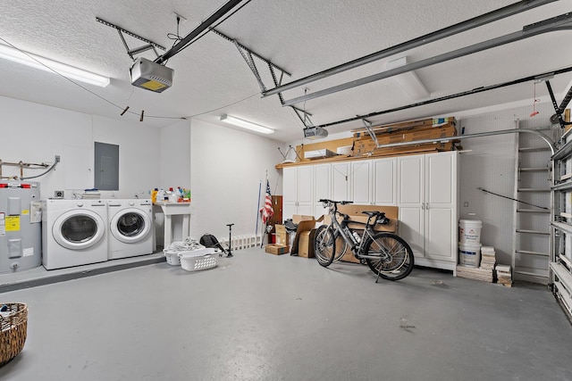 garage with electric panel, water heater, a sink, a garage door opener, and independent washer and dryer