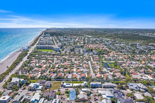 bird's eye view featuring a residential view, a view of the beach, and a water view