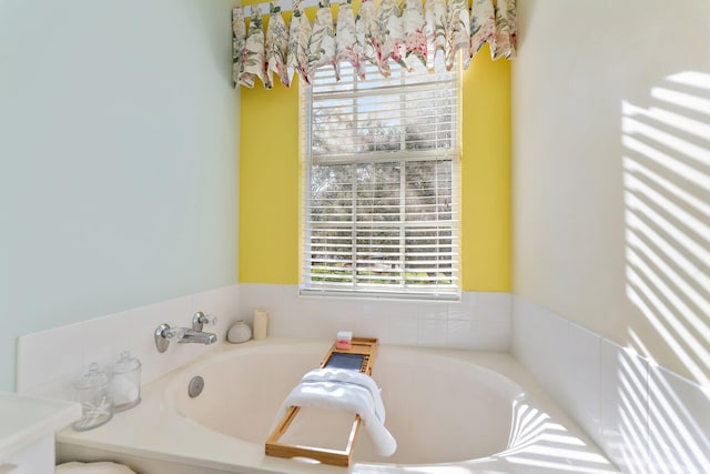 bathroom featuring a garden tub and radiator