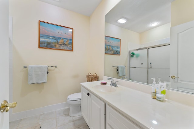 full bathroom featuring baseboards, toilet, a stall shower, tile patterned floors, and vanity