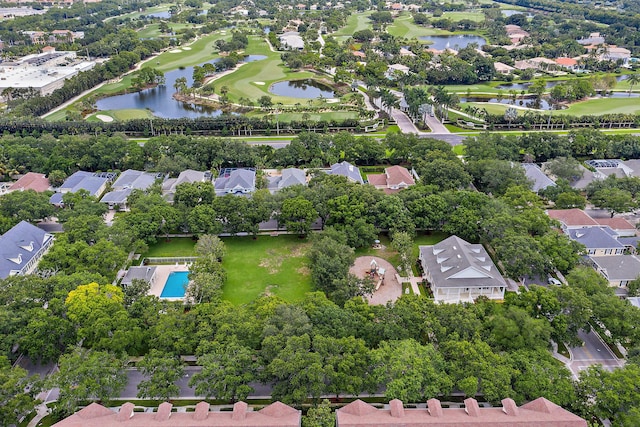 drone / aerial view with a residential view and a water view