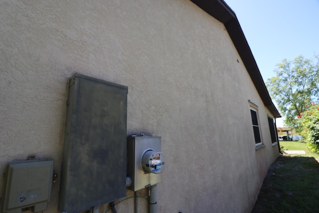 view of side of property featuring stucco siding