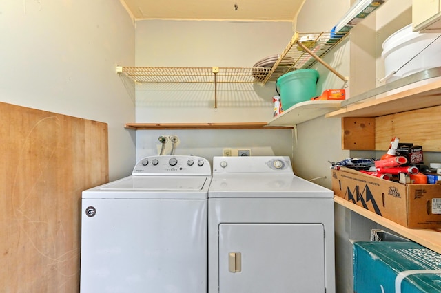 laundry room featuring washing machine and clothes dryer and laundry area