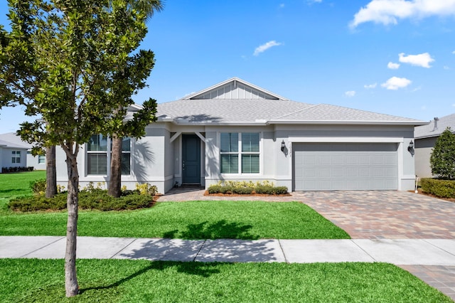 single story home with stucco siding, decorative driveway, and a front lawn