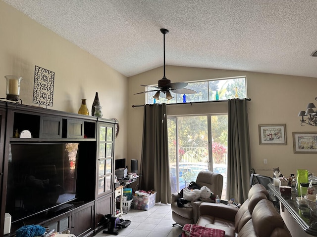 living room with light tile patterned floors, a textured ceiling, a ceiling fan, and vaulted ceiling