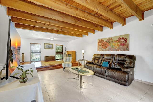 tiled living room with beam ceiling, wood ceiling, and baseboards