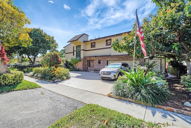 10476 SW 52nd St, Cooper City, FL 33328 - view of front facade with stucco siding, driveway, brick siding, and an attached garage