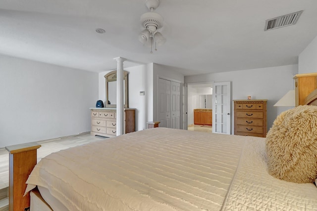 bedroom featuring visible vents and ceiling fan