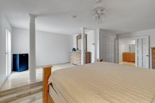 10476 SW 52nd St, Cooper City, FL 33328 - bedroom with ornate columns, ceiling fan, and connected bathroom