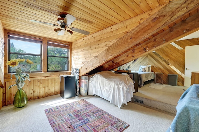 carpeted bedroom with wood ceiling, wood walls, and ceiling fan