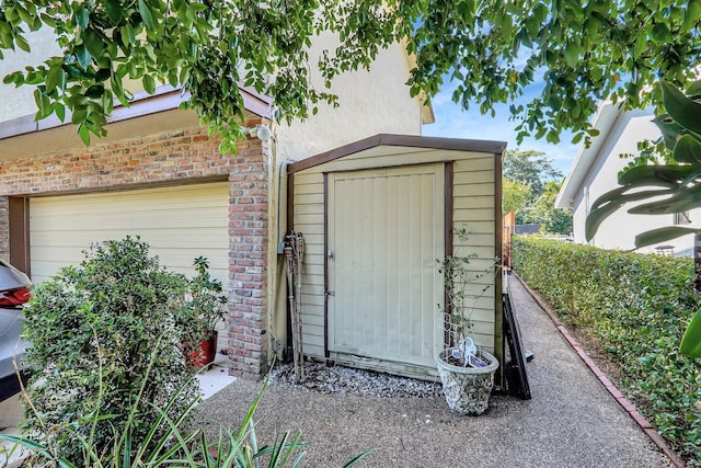 view of shed featuring an attached garage