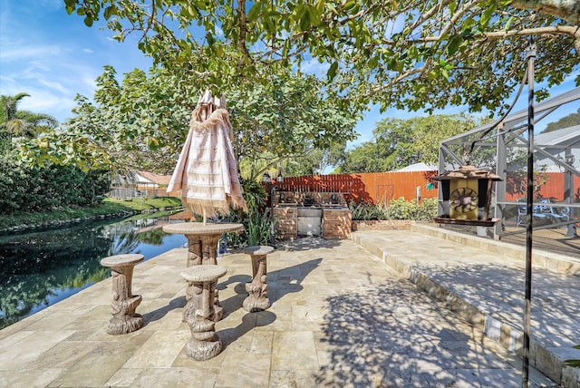 10476 SW 52nd St, Cooper City, FL 33328 - fenced backyard featuring a patio, exterior kitchen, and a lanai