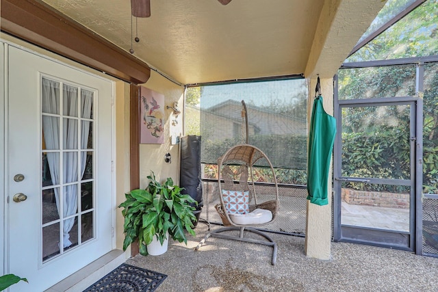 sunroom with a ceiling fan