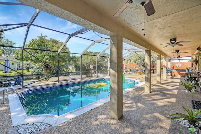 pool featuring fence, a lanai, a ceiling fan, and a patio area