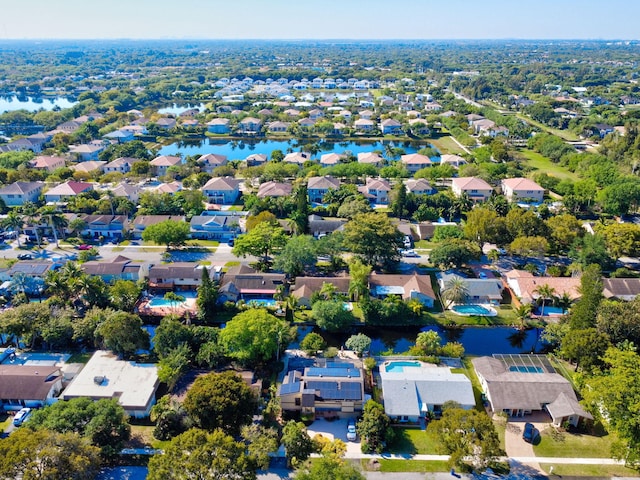 bird's eye view featuring a residential view and a water view