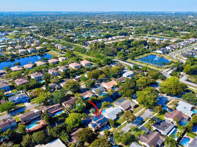 birds eye view of property featuring a water view and a residential view