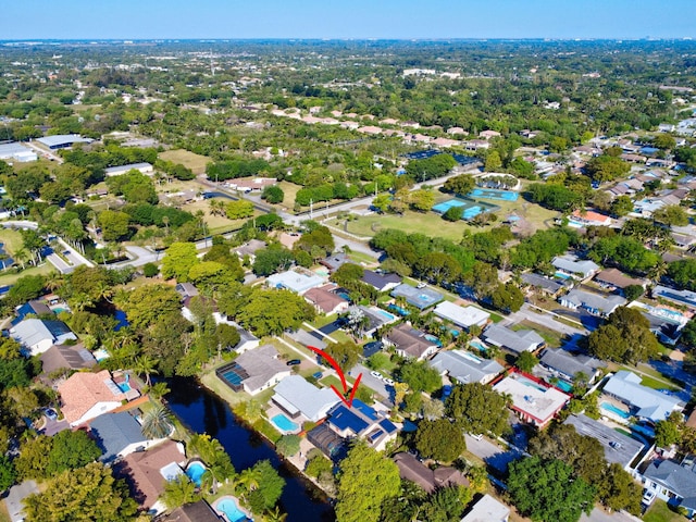 aerial view featuring a water view and a residential view