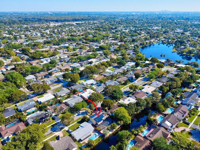 birds eye view of property featuring a residential view and a water view