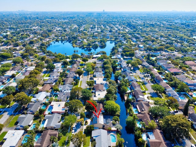 drone / aerial view with a residential view and a water view