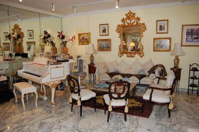 dining space featuring marble finish floor and ornamental molding