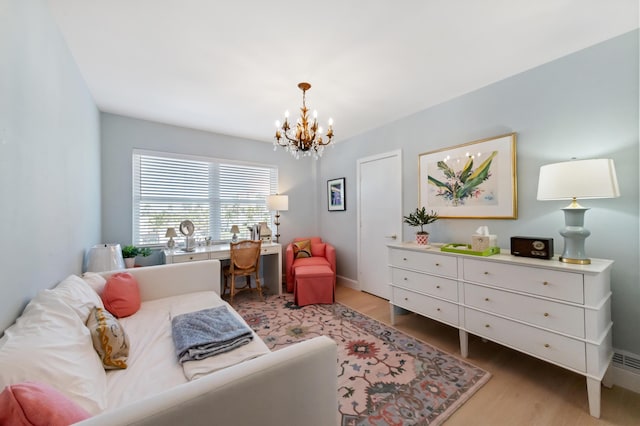 bedroom with a notable chandelier and wood finished floors