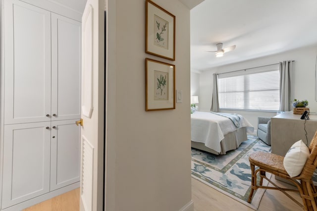 bedroom featuring light wood-type flooring and ceiling fan