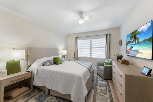 bedroom with a ceiling fan and light wood finished floors