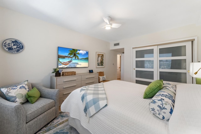 bedroom featuring visible vents and ceiling fan