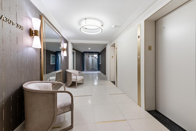 corridor with elevator and tile patterned flooring