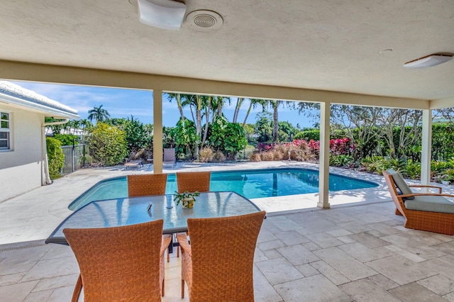 pool featuring a patio and fence