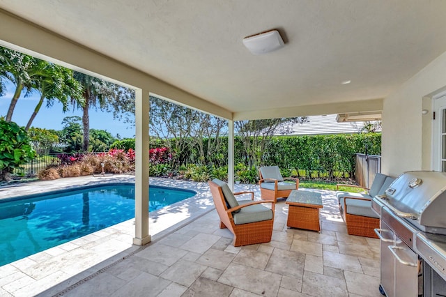 view of patio / terrace with a fenced in pool, a grill, and a fenced backyard