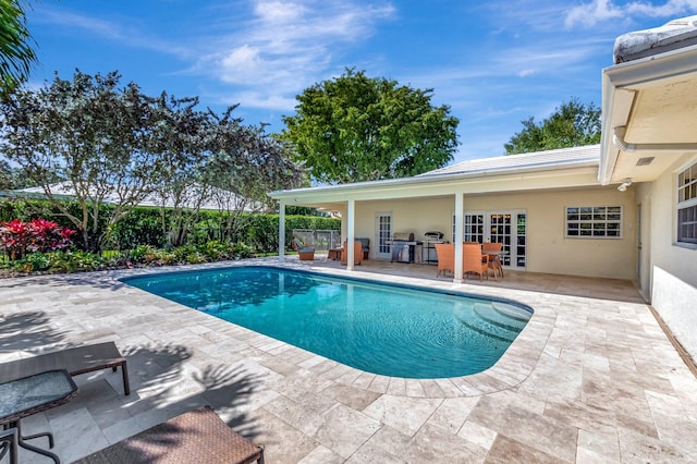 view of swimming pool featuring a fenced in pool, a patio, and fence