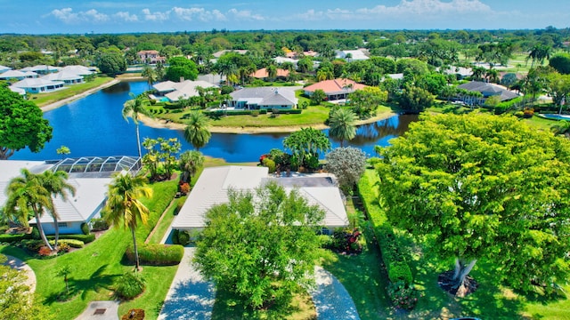 drone / aerial view with a residential view and a water view