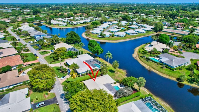 birds eye view of property featuring a residential view and a water view