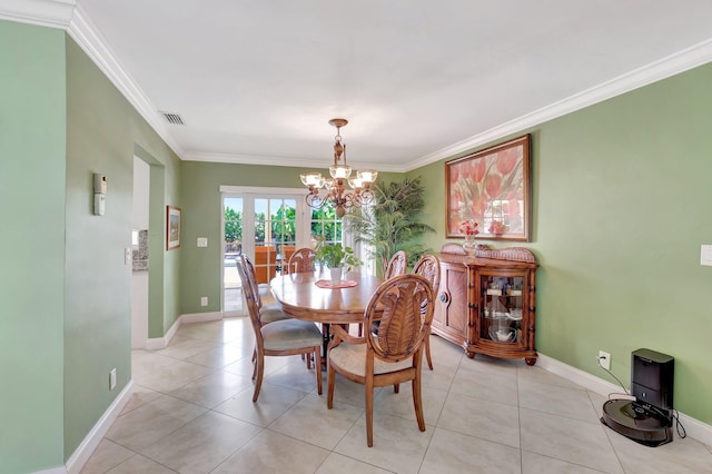 dining space featuring visible vents, baseboards, ornamental molding, light tile patterned floors, and a notable chandelier