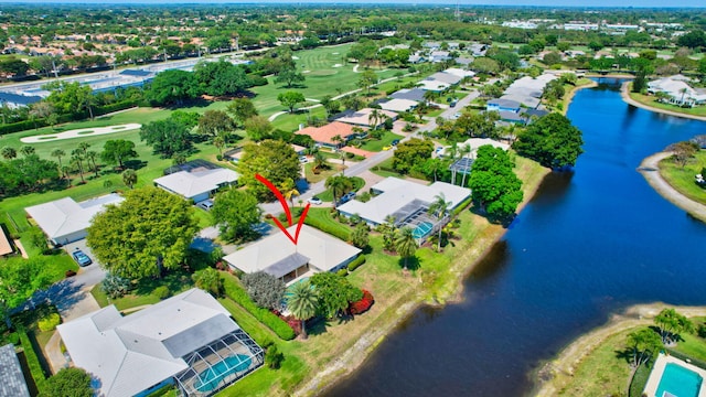 birds eye view of property with a residential view and a water view