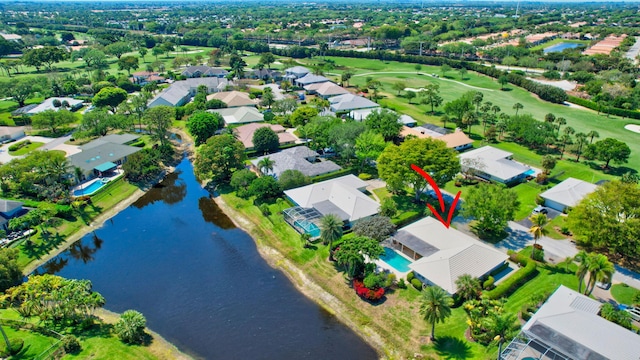 drone / aerial view with a residential view and a water view